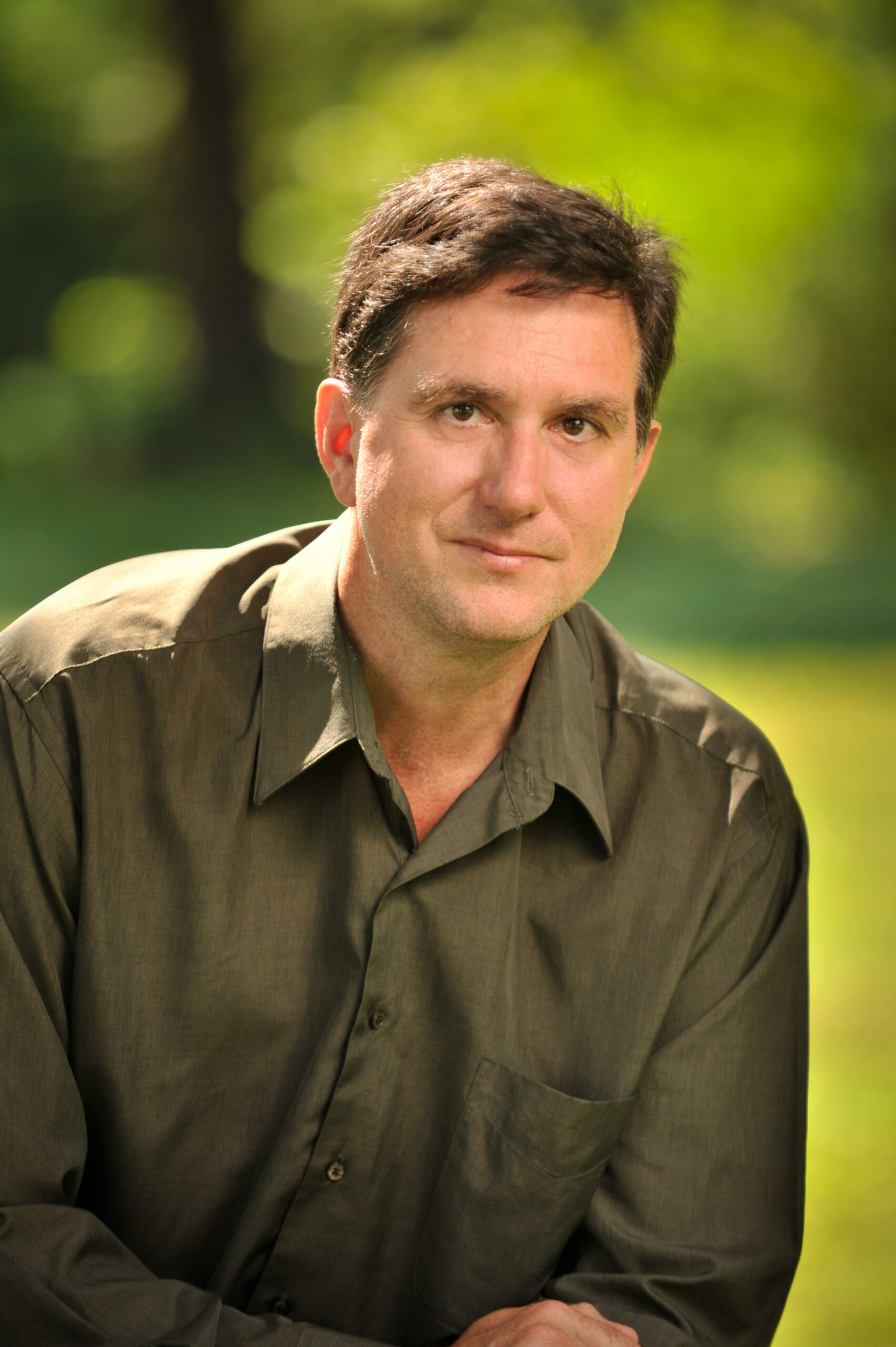 Headshot of Scott Owens with nature in the background