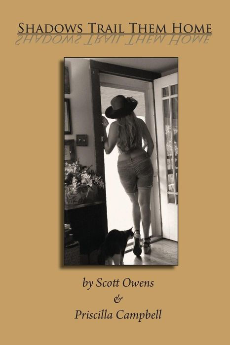 Back of a woman looking out an open door